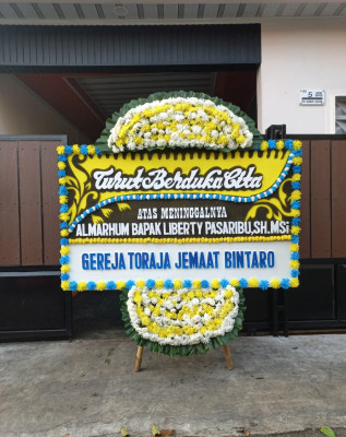 Papan Bunga Duka di Wame